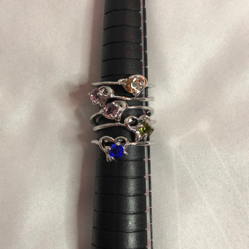 Pack of 5 silver rings with multi colored gems